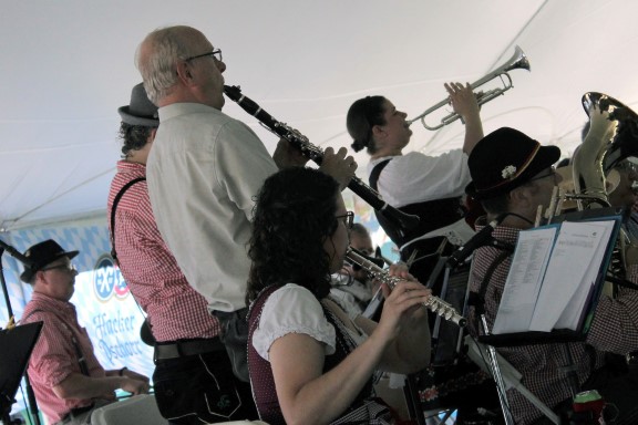 Several band members standing up while playing.